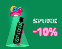 Promotional banner on a green background offering a 10% discount on Spunk, featuring a whimsical UFO beaming down a black bottle of Spunk Pure Silicone Lubricant next to distressed white product branding text.