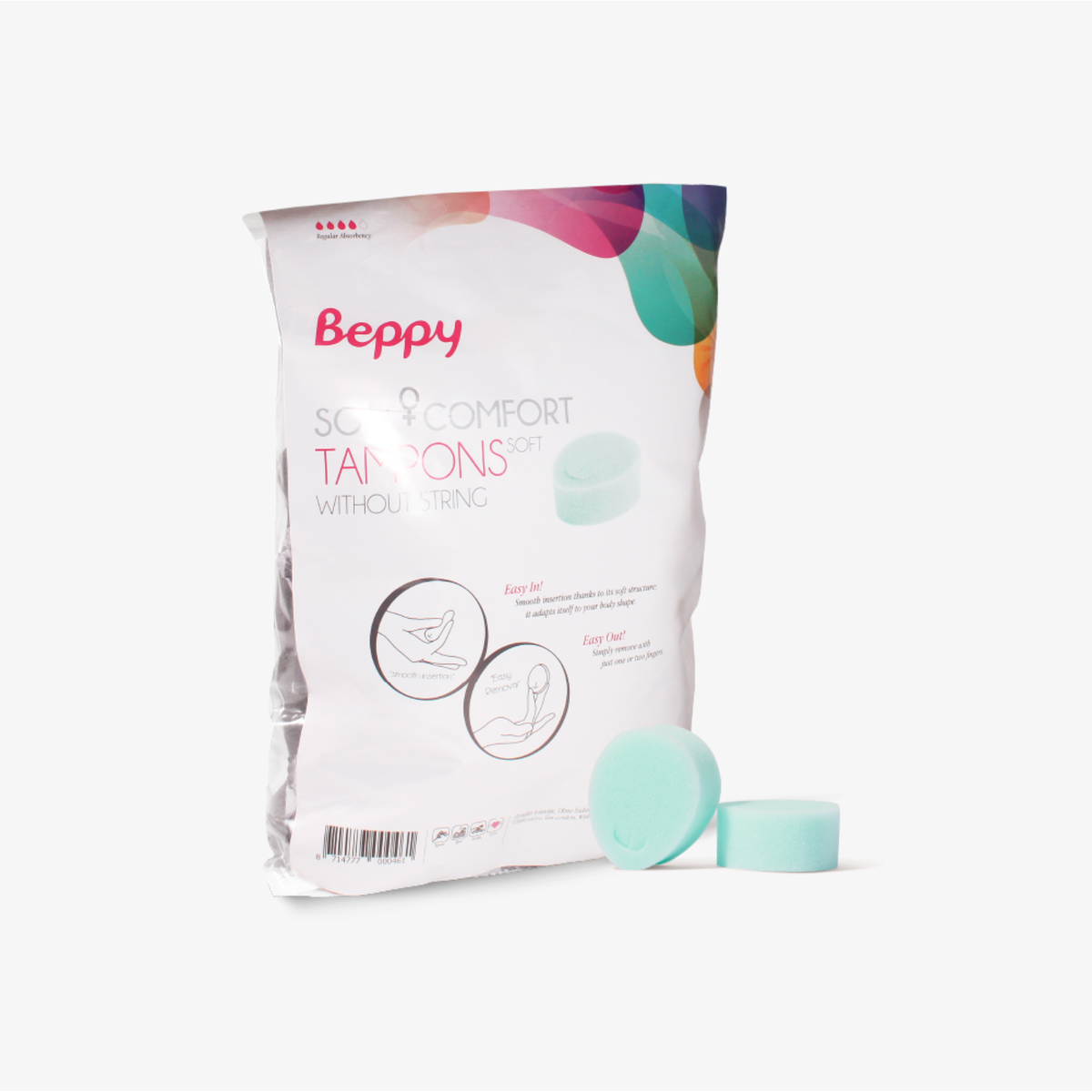 A product photograph of the Beppy Soft Comfort Tampons Dry. The white plastic packaging features the pink Beppy logo and colorful abstract graphics. Two mint green sponges are displayed in front of the bag. The package includes diagrams showing "Easy In" and "Easy Out" instructions for stringless use.