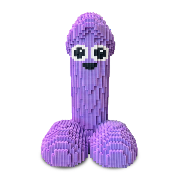 Front studio shot of the fully assembled light purple 3D block sculpture of an anatomical shape with cartoon eyes and mouth, built from interlocking plastic mini-bricks.