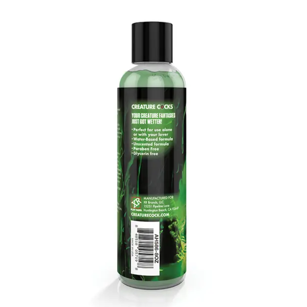 Studio view focusing on the right-side back panel of the squeeze bottle showing key features (water-based, unscented, paraben-free, glycerin-free), barcode, and manufacturer details.
