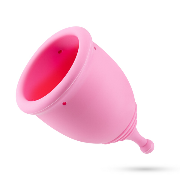 Close-up of the pink menstrual cup, showing the rim, air holes, and stem.