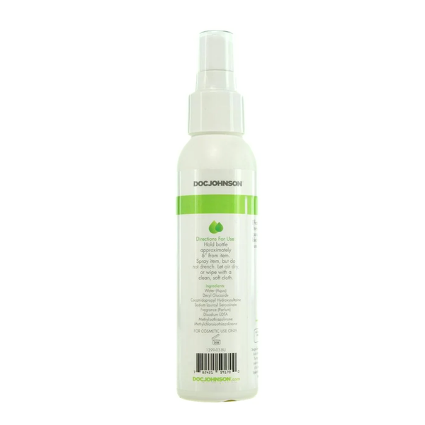 Back packaging label view of the Doc Johnson Natural Toy Cleaner spray bottle, detailing usage directions, ingredients, triclosan-free claim, and a barcode.