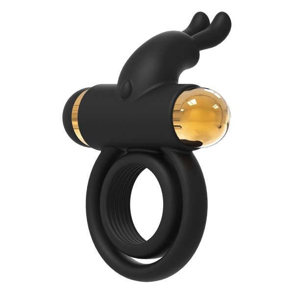 Angled view of the black vibrating cock ring, highlighting the gold-capped end and the rabbit-ear stimulators.
