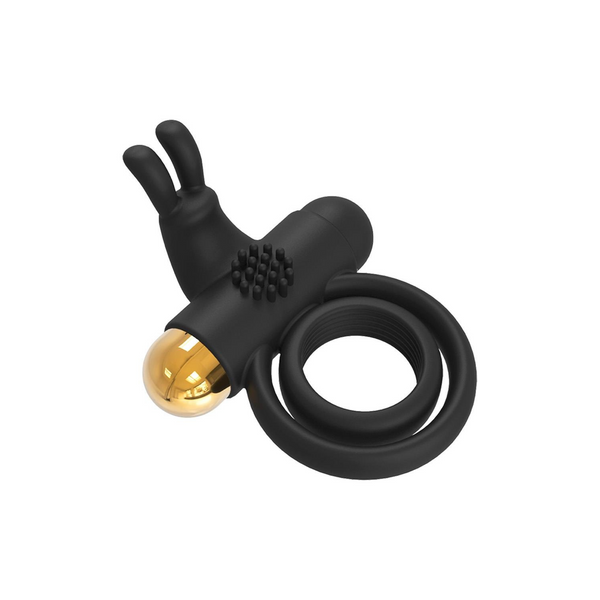 Side view of the black vibrating cock ring, showing the spiral loop, the textured area, and the gold-capped end.