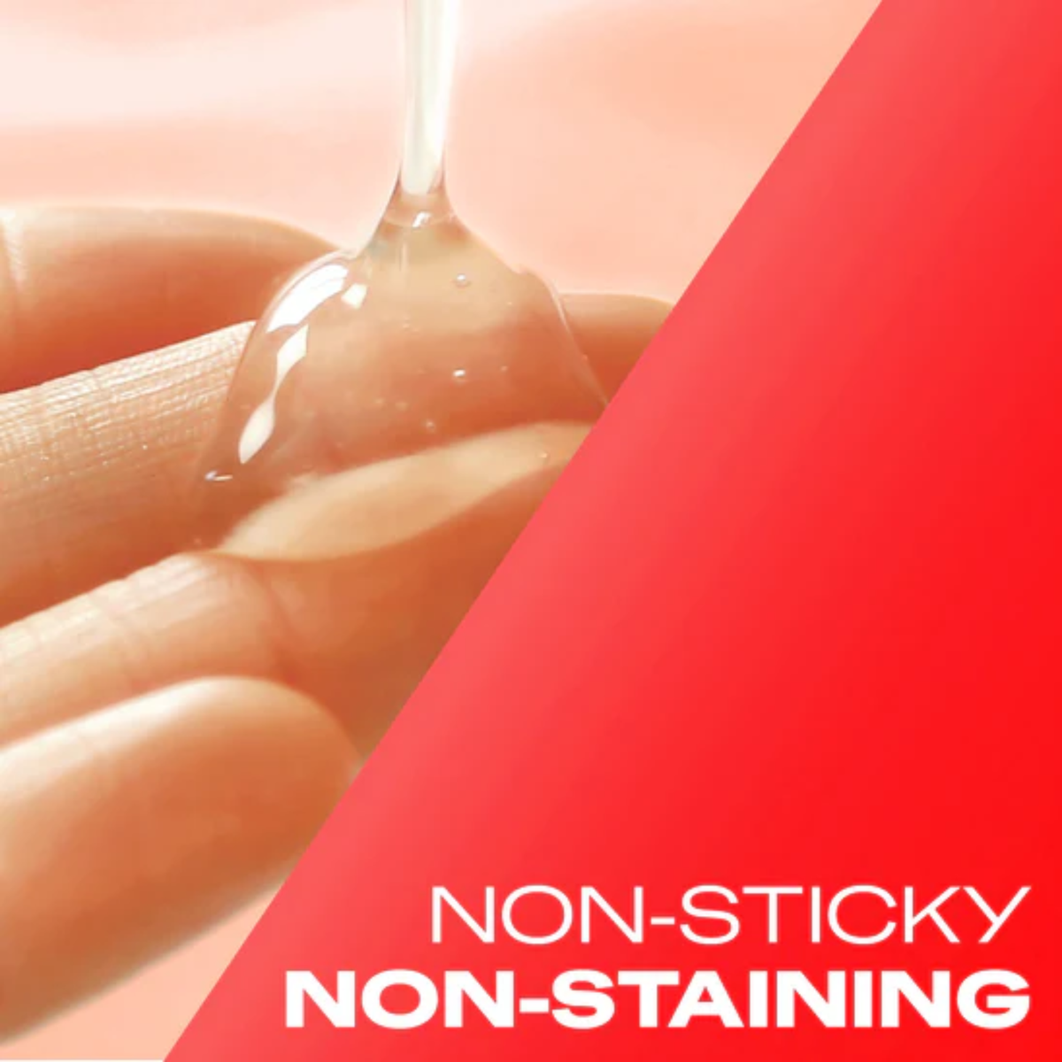 A close-up image showing a generous droplet of clear, viscous lubricant gel dripping onto a person's hand, indicating its texture. A diagonal red overlay covers the right side with the text: "NON-STICKY NON-STAINING".