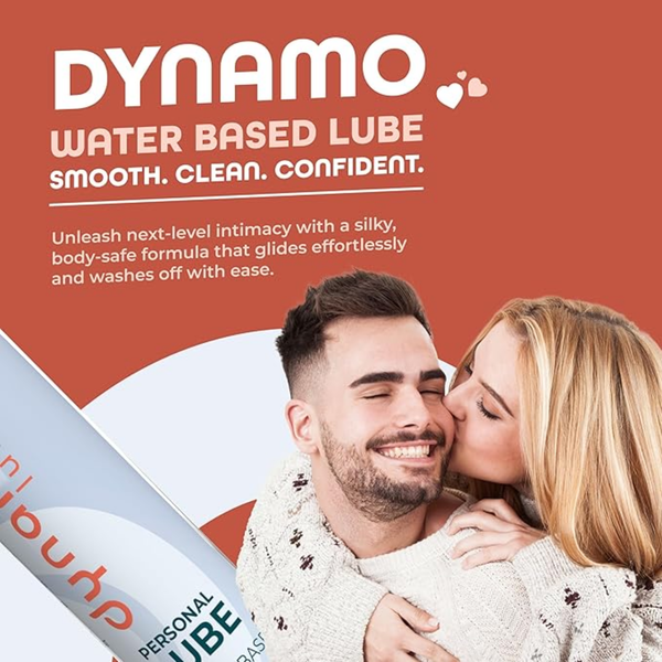 Promotional lifestyle graphic featuring the Dynamo Water Based Lube text and slogan ("Smooth. Clean. Confident.") alongside an image of a smiling couple kissing.