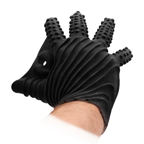 Close-up of a person's hand wearing the black, ribbed, and textured silicone glove.