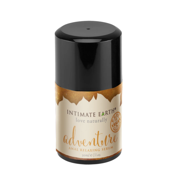 Isolated product view of the compact 30 ml (1 fl oz) Intimate Earth Adventure anal relaxing serum pump bottle featuring a large black overcap and gold-accented label with pure vegan seal.