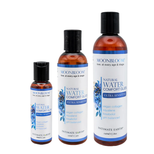 Size comparison view showing three amber bottles of Intimate Earth Moon Bloom water comfort glide standing side by side in 60 ml (2 fl oz), 120 ml (4 fl oz), and 240 ml (8 fl oz) capacities.
