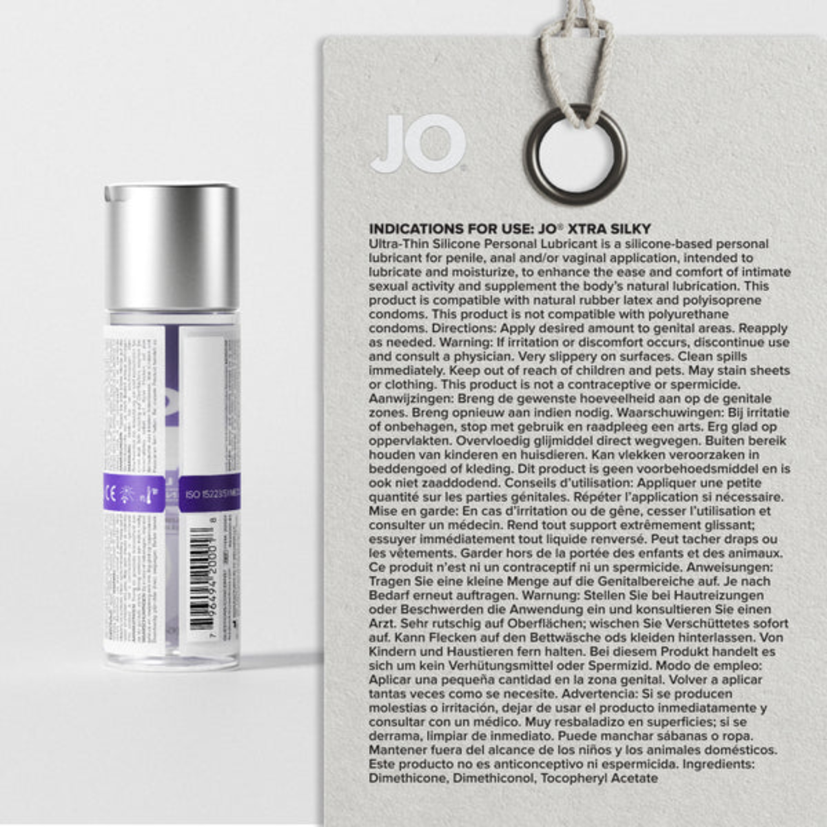 The back label of a JO Xtra Silky bottle displayed next to a magnified, easy-to-read version of its "Indications for Use" text. The panel details application directions, warnings, and ingredients.