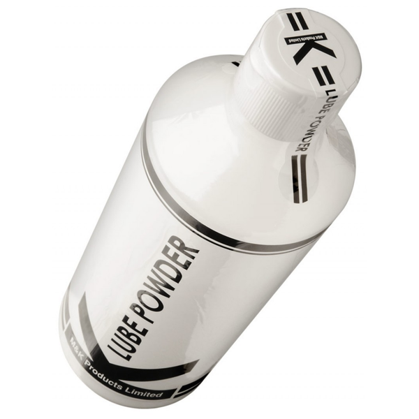 An overhead angled view showing the top of the bottle. The white flip-top cap is protected by a clear plastic safety seal. The seal is printed with the "K" logo and the words "LUBE POWDER" in black, ensuring the product is tamper-evident.