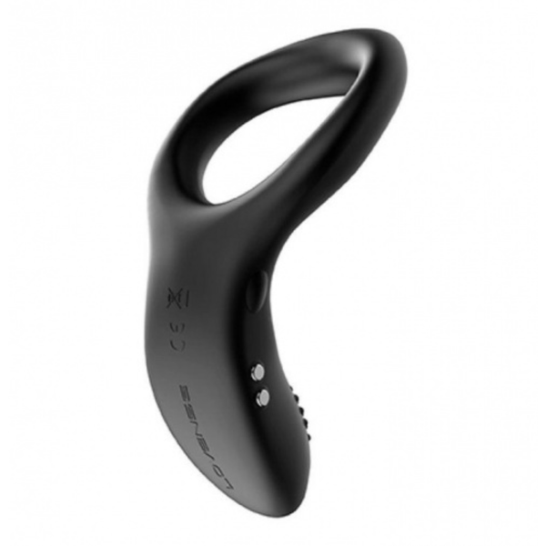 Studio product view showing the side profile of the black silicone Lovense Diamo vibrating cock ring, detailing its magnetic charging contacts and raised power button.