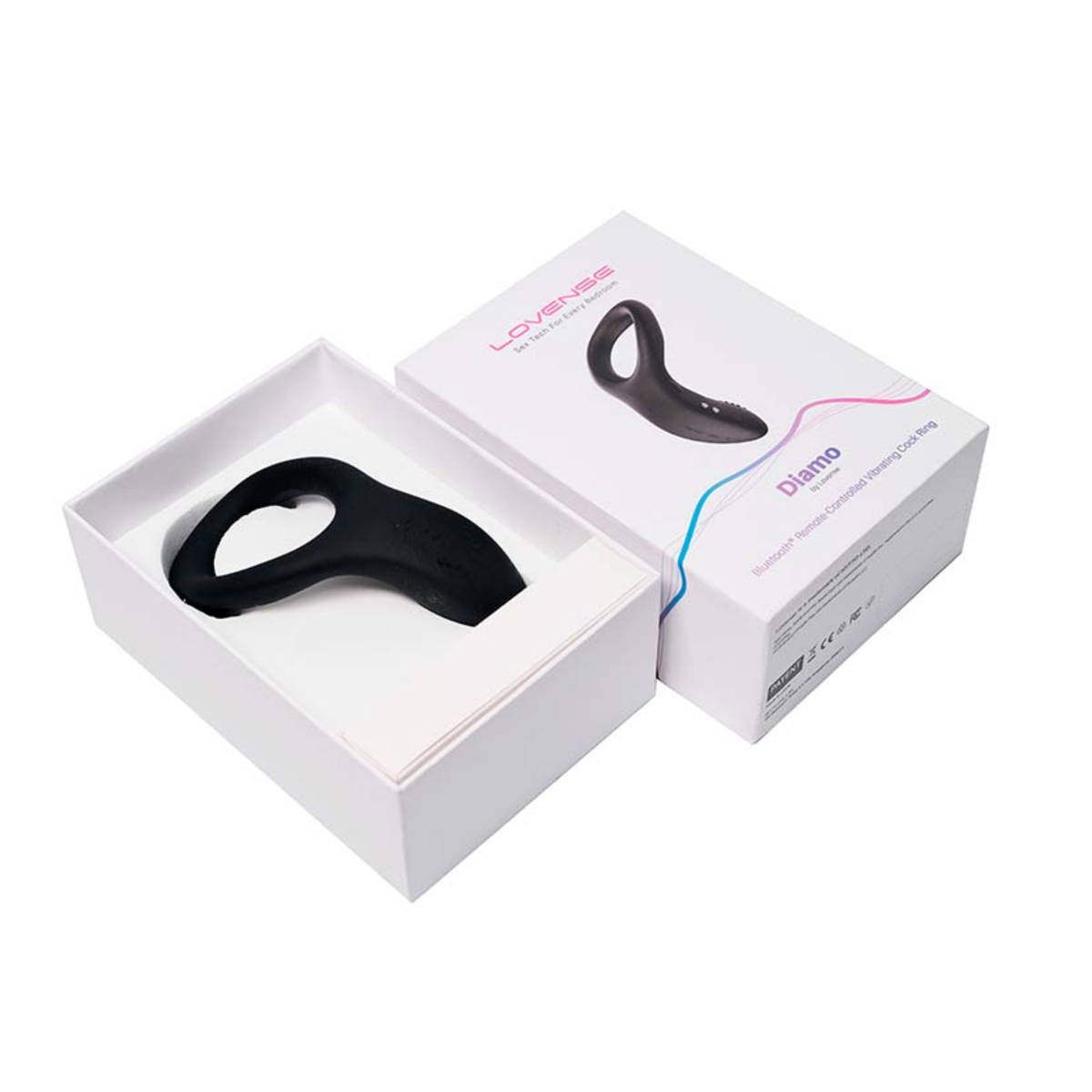 Unboxing photo displaying the black Lovense Diamo cock ring resting inside its open white packaging box next to the lid.