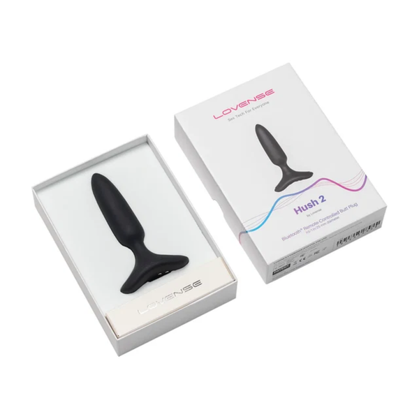 Unboxing photo showing the black 1-inch Lovense Hush 2 butt plug nestled inside its open white packaging box.