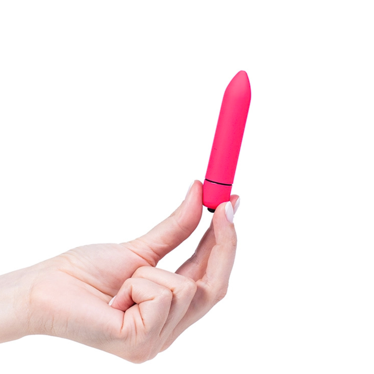 Scale reference photo showing a hand holding the bright pink bullet vibrator upright by its base.