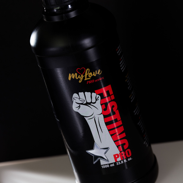 Close-up, angled view of the upper half of the MyLove Fisting Pro Gel 1000 ml bottle. The photo highlights the "myLove PRO series" logo, raised fist graphic, and red "FISTING PRO" branding.