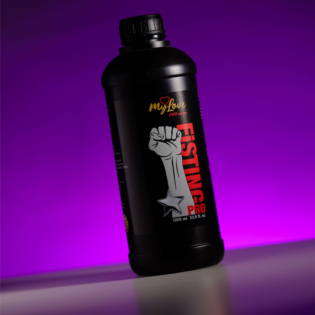 Front view of the 1000 ml MyLove Fisting Pro Gel bottle, angled slightly on a white surface against a vibrant purple backlit background.