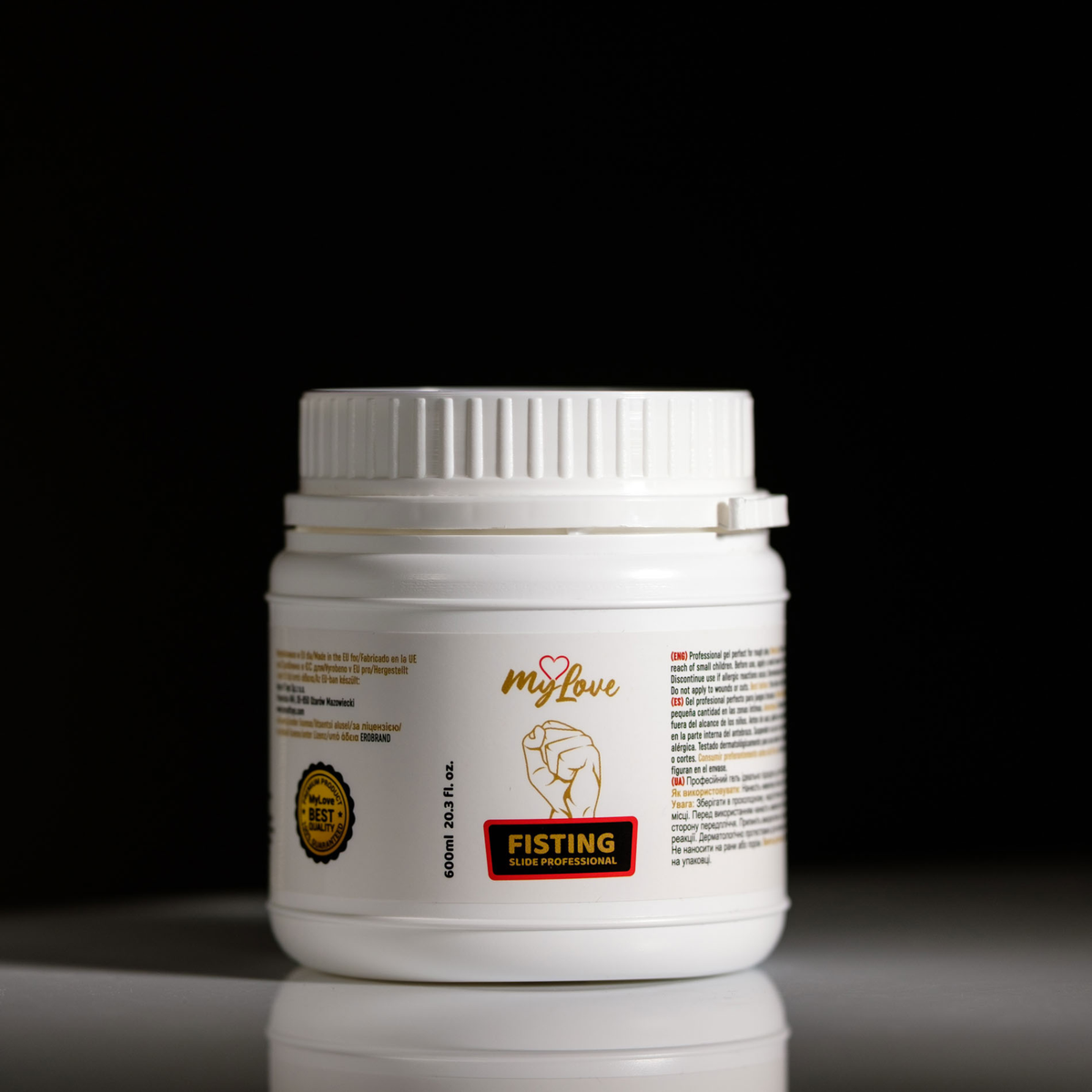 Front view of the 600 ml MyLove Fisting Slide Professional gel tub standing centered on a white surface against a solid black background.