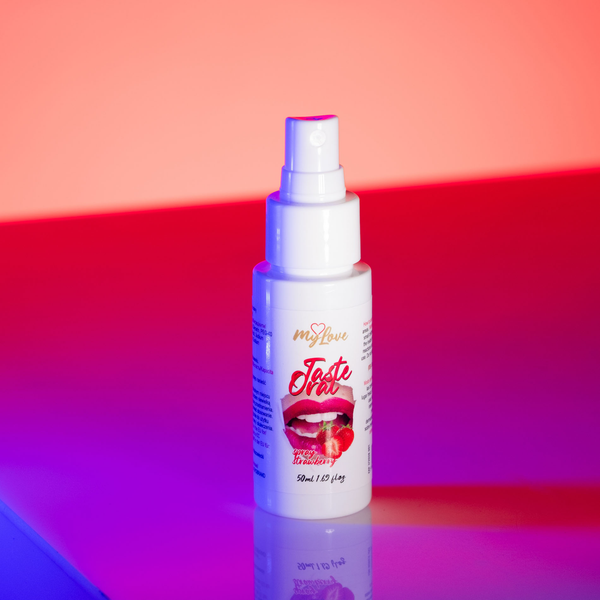 Front view of the 50 ml MyLove Taste Oral Spray bottle illuminated under dynamic pink and blue studio lighting.