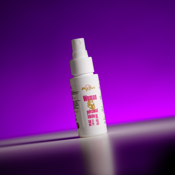 Front view of the 50 ml MyLove Woman Personal Libido Med Spray bottle, angled slightly on a white surface against a vibrant purple backlit background.