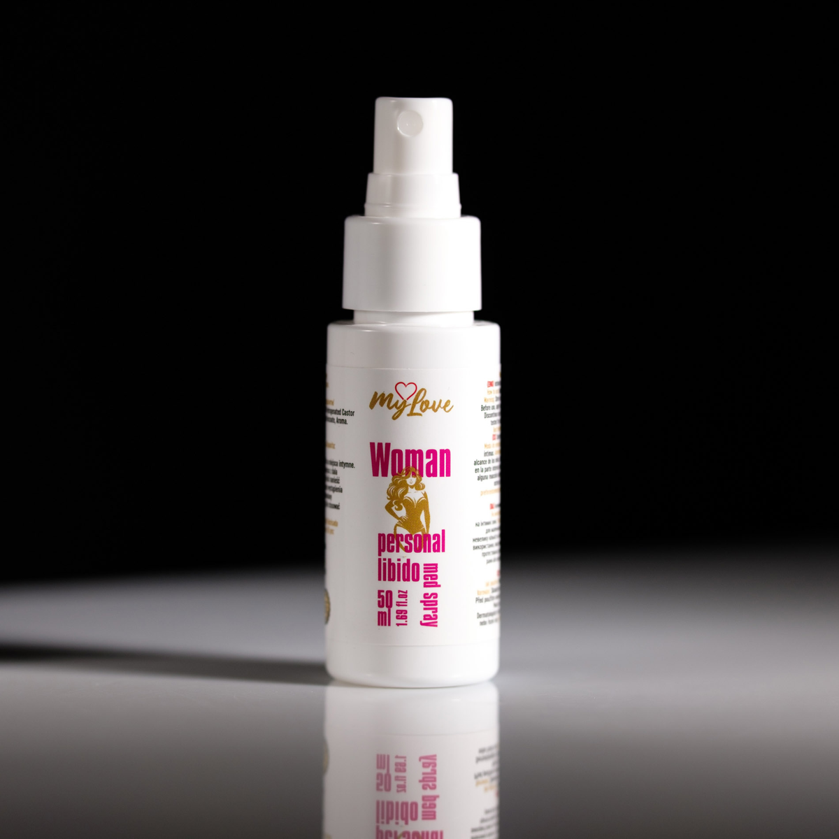 Front view of the 50 ml MyLove Woman Personal Libido Med Spray bottle standing centered on a white surface against a solid black background.