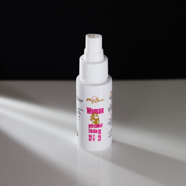 Front-angle view of the 50 ml MyLove Woman Personal Libido Med Spray bottle standing on a white reflective surface against a solid black backdrop with soft side lighting.