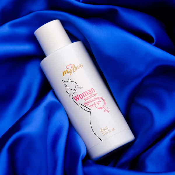 The 150 ml bottle of MyLove Woman Sensitive Tightening Med Gel rests diagonally on draped, rich royal blue satin fabric.