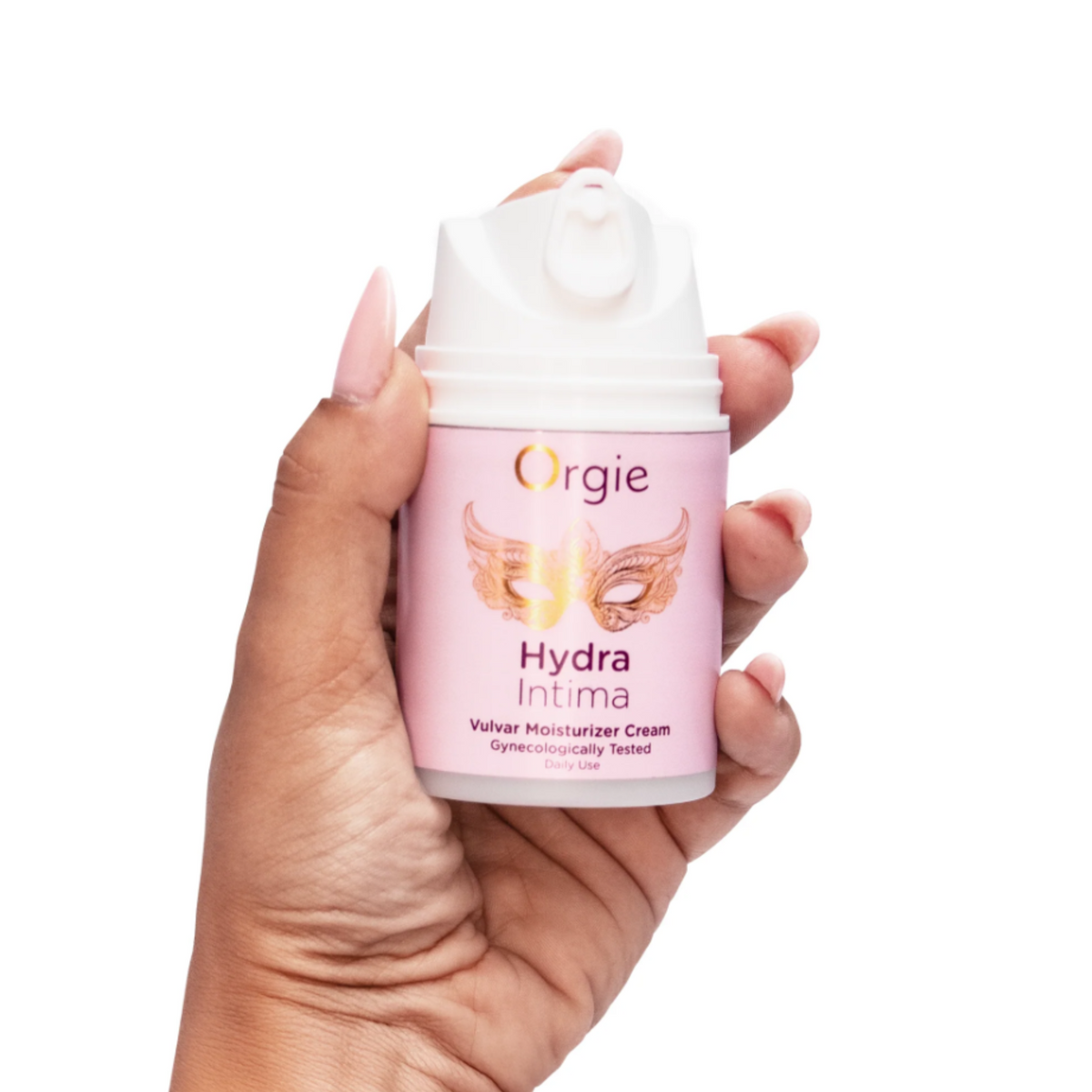 A hand holding the Orgie Hydra Intima Vulvar Moisturizer Cream bottle against a white background.