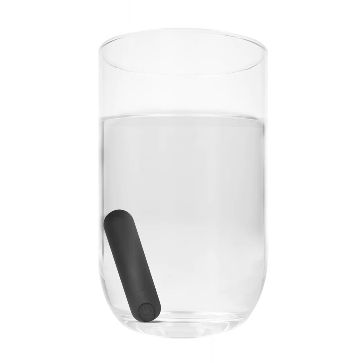 The black bullet vibrator is shown submerged in a glass of water, illustrating its waterproof feature.