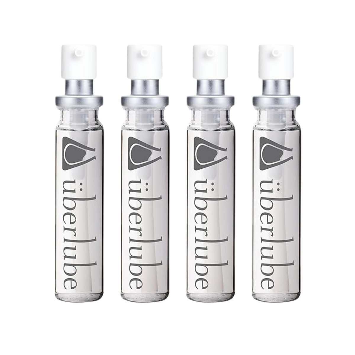 Four transparent glass spray bottles of Überlube lubricant, each with "überlube" and a stylized eye logo printed vertically, stand in a row. These travel-friendly WorldCondoms offerings provide discreet, on-the-go intimacy.