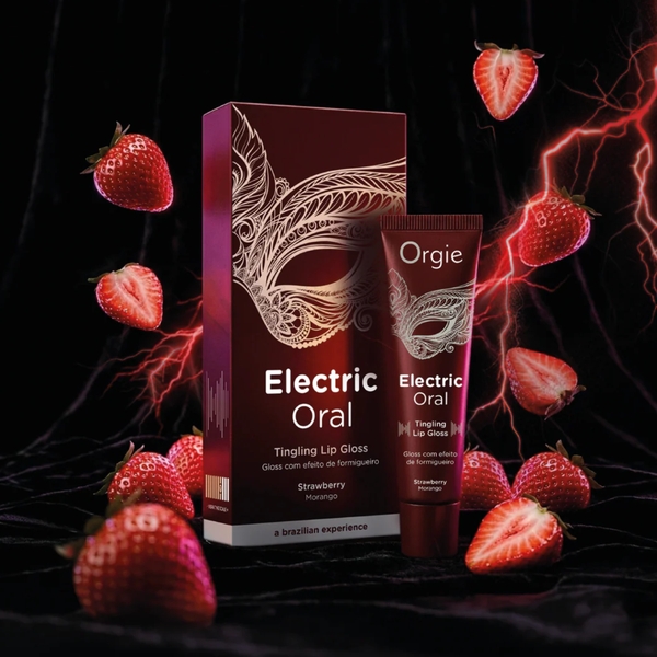 A dramatic promotional image for the Orgie "Electric Oral" lip gloss. The maroon box and tube stand on a dark, velvety black surface. Fresh, sliced strawberries float in the air around the product, complemented by vibrant red streaks of digital lightning and energy waves in the background to emphasize the "electric" sensation.