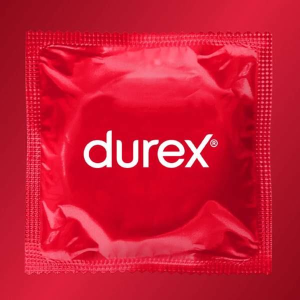 A close-up, top-down view of a single, square red foil condom wrapper with the "durex" logo centered in white text against a soft red background.