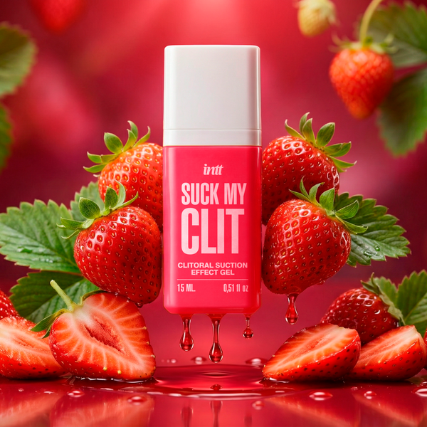 The intt Suck My Clit Wild Strawberry product bottle is shown with a thick, red gel dripping smoothly from its base. It is surrounded by fresh strawberries and green leaves against a vibrant red background.
