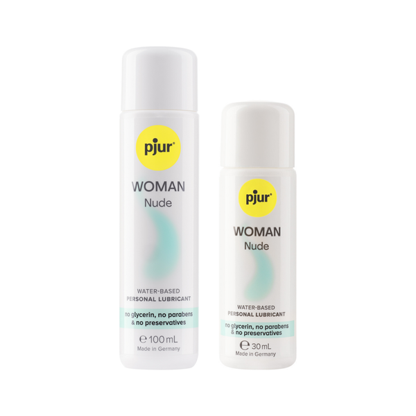 A two white bottles of pjur WOMAN Nude water-based personal lubricants with a yellow logo and teal accents on a white background.