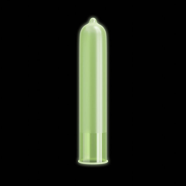 A translucent, glowing green Pasante Glow condom against a black background.